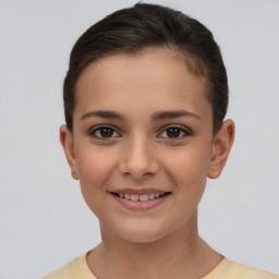 Joyful white child female with short  brown hair and brown eyes