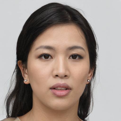 Neutral asian young-adult female with long  brown hair and brown eyes