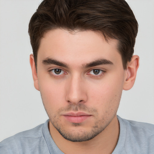 Neutral white young-adult male with short  brown hair and brown eyes