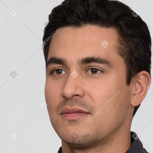 Neutral white young-adult male with short  black hair and brown eyes
