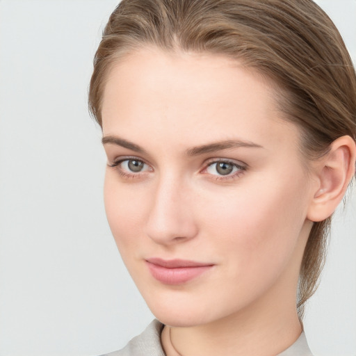 Neutral white young-adult female with medium  brown hair and grey eyes