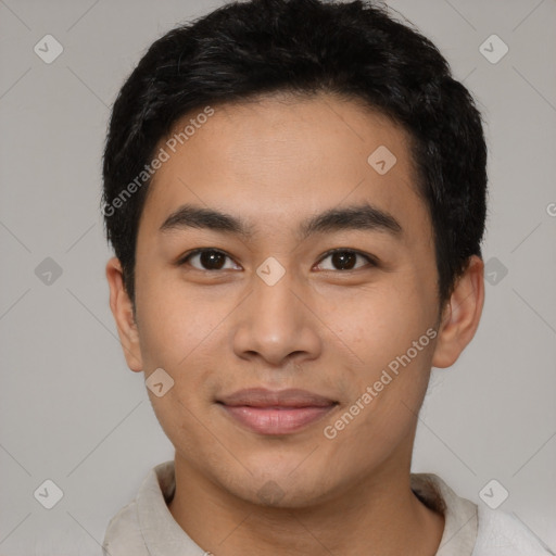 Joyful latino young-adult male with short  black hair and brown eyes