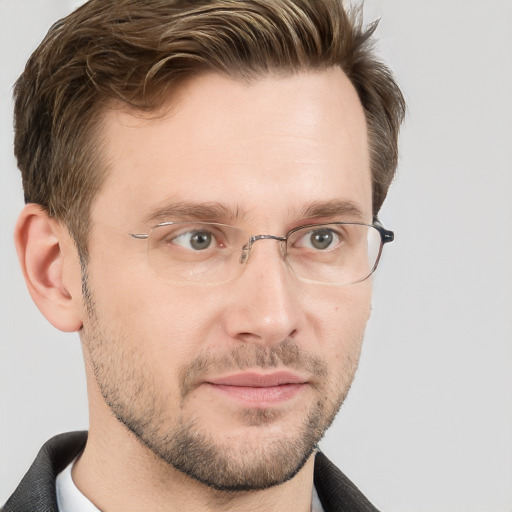 Joyful white adult male with short  brown hair and grey eyes