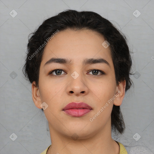 Joyful latino young-adult female with medium  brown hair and brown eyes