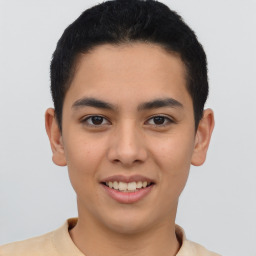 Joyful latino young-adult male with short  brown hair and brown eyes