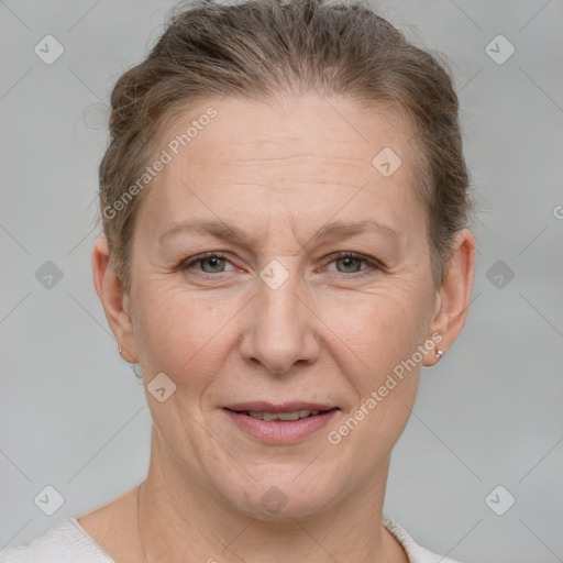 Joyful white adult female with short  brown hair and grey eyes