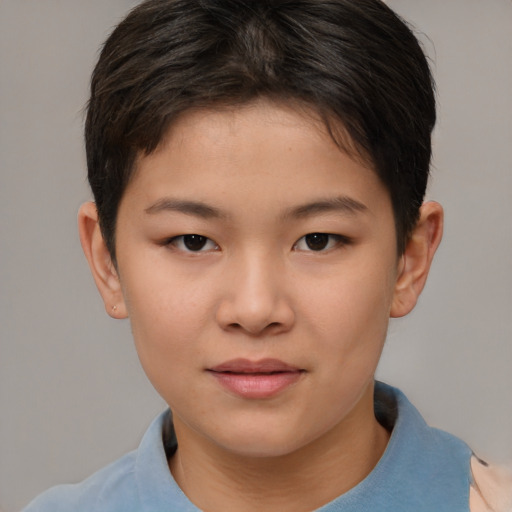 Joyful asian child female with short  brown hair and brown eyes