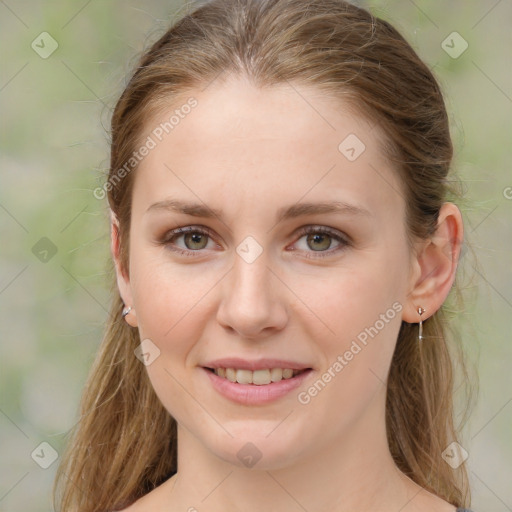 Joyful white young-adult female with medium  brown hair and green eyes