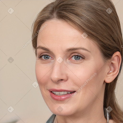 Joyful white adult female with long  brown hair and grey eyes