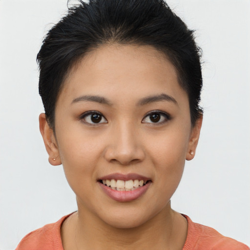 Joyful asian young-adult female with short  brown hair and brown eyes