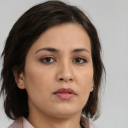 Neutral asian young-adult female with medium  brown hair and brown eyes