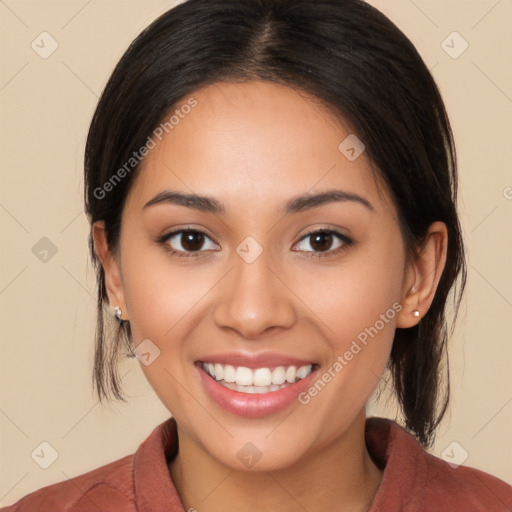 Joyful latino young-adult female with medium  brown hair and brown eyes