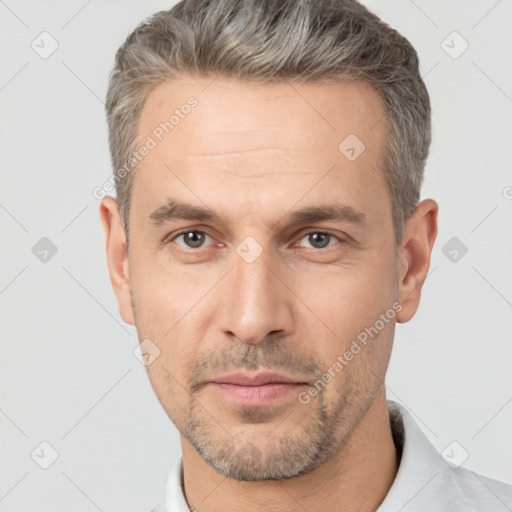 Neutral white adult male with short  brown hair and brown eyes