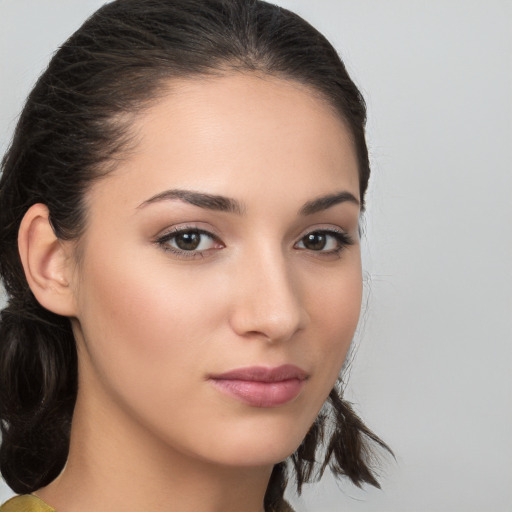 Neutral white young-adult female with medium  brown hair and brown eyes