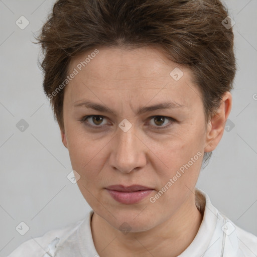 Joyful white adult female with short  brown hair and brown eyes