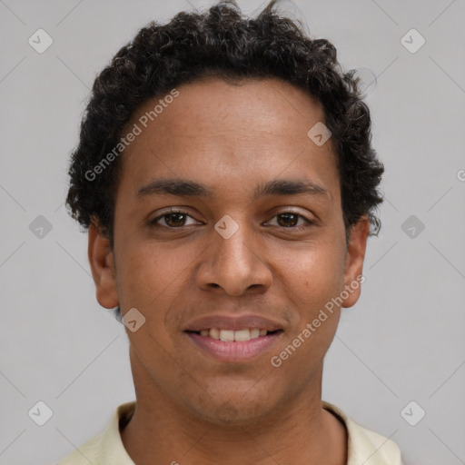 Joyful latino young-adult male with short  brown hair and brown eyes