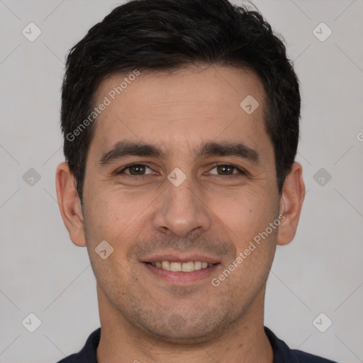 Joyful white young-adult male with short  black hair and brown eyes