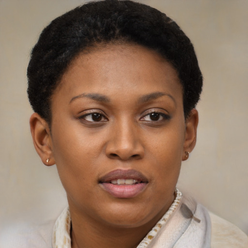 Joyful black young-adult female with short  brown hair and brown eyes