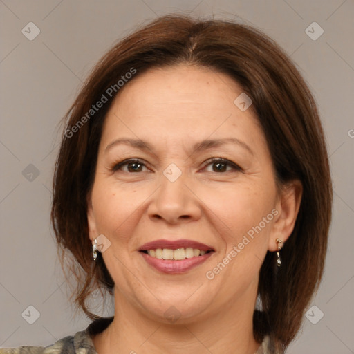 Joyful white adult female with medium  brown hair and brown eyes