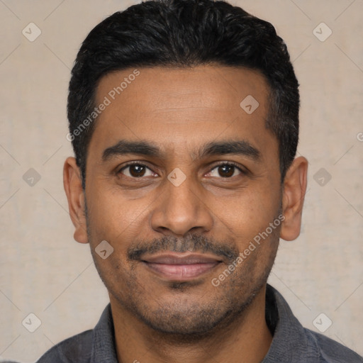 Joyful latino young-adult male with short  black hair and brown eyes