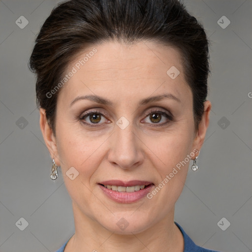 Joyful white adult female with short  brown hair and grey eyes