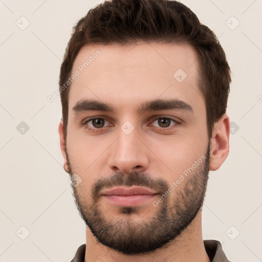 Neutral white young-adult male with short  brown hair and brown eyes