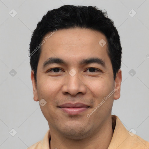 Joyful asian young-adult male with short  black hair and brown eyes