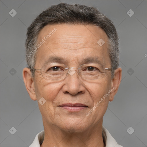 Joyful white middle-aged male with short  gray hair and brown eyes