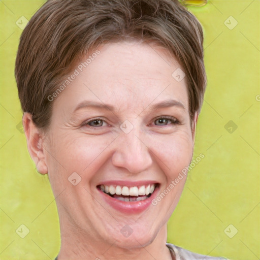 Joyful white adult female with short  brown hair and brown eyes