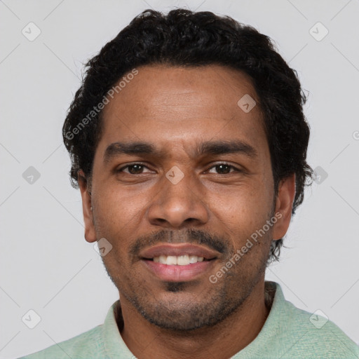 Joyful black adult male with short  black hair and brown eyes