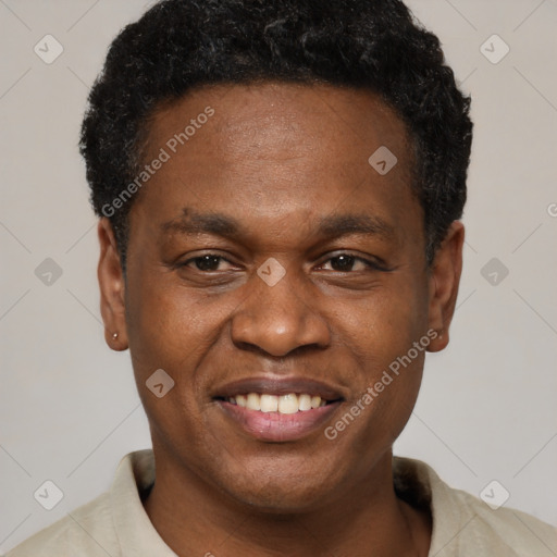 Joyful black young-adult male with short  black hair and brown eyes