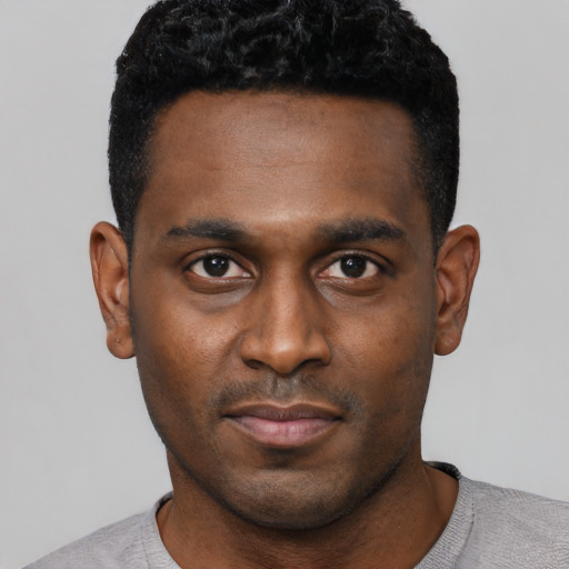 Neutral black young-adult male with short  black hair and brown eyes
