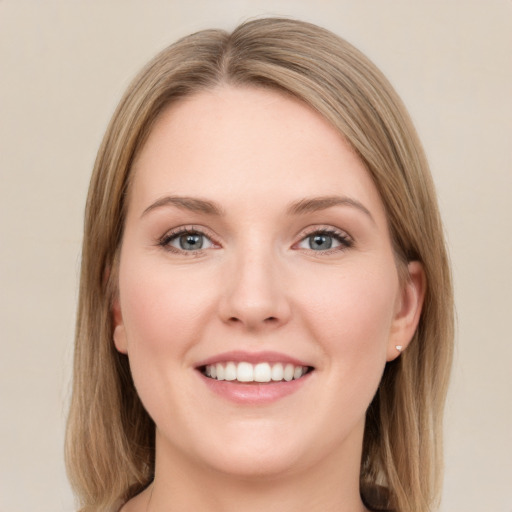 Joyful white young-adult female with long  brown hair and green eyes