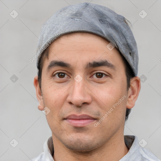 Joyful white adult male with short  black hair and brown eyes