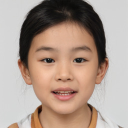 Joyful asian child female with medium  brown hair and brown eyes