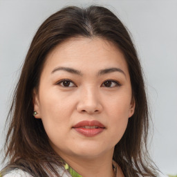 Joyful white young-adult female with medium  brown hair and brown eyes