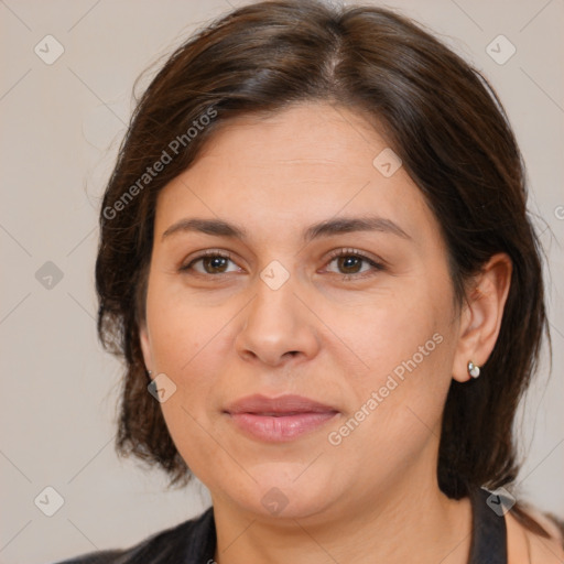 Joyful white adult female with medium  brown hair and brown eyes