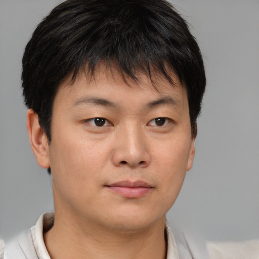Neutral asian young-adult male with short  brown hair and brown eyes