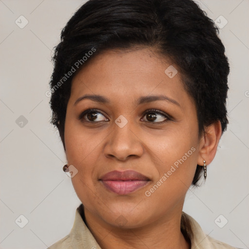 Joyful latino adult female with short  brown hair and brown eyes