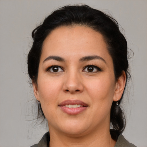 Joyful asian young-adult female with medium  black hair and brown eyes