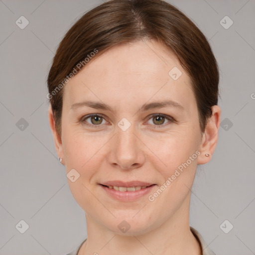 Joyful white young-adult female with short  brown hair and grey eyes