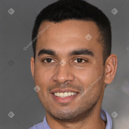 Joyful black young-adult male with short  brown hair and brown eyes