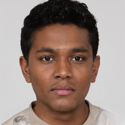 Neutral black young-adult male with short  black hair and brown eyes