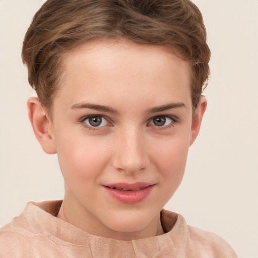 Joyful white child female with short  brown hair and brown eyes