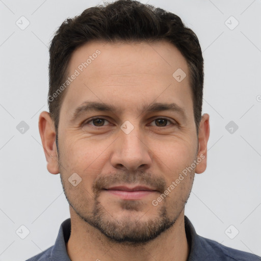 Joyful white adult male with short  brown hair and brown eyes