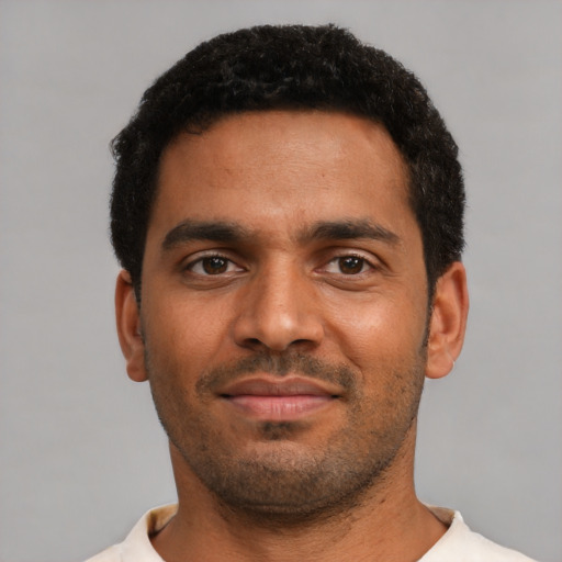 Neutral black young-adult male with short  black hair and brown eyes