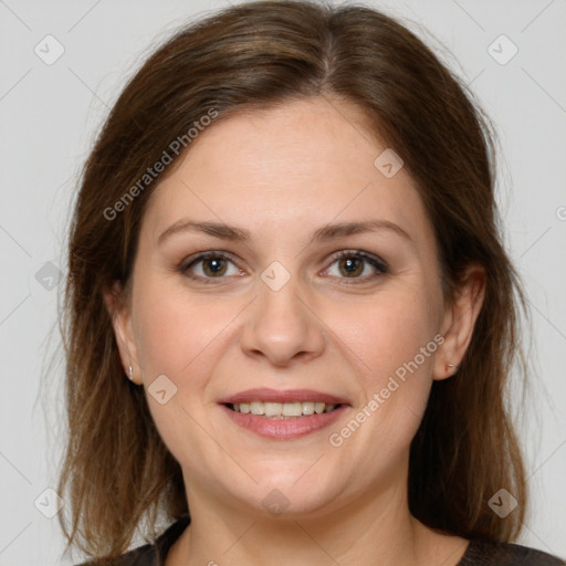 Joyful white young-adult female with medium  brown hair and grey eyes