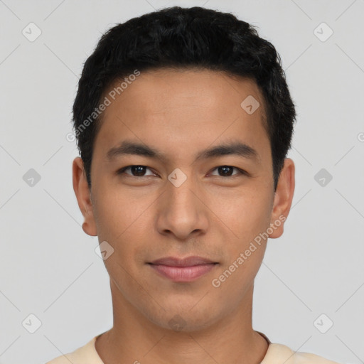 Joyful latino young-adult male with short  black hair and brown eyes