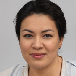 Joyful asian young-adult female with medium  brown hair and brown eyes