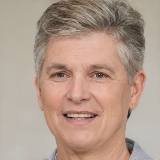 Joyful white middle-aged male with short  brown hair and grey eyes